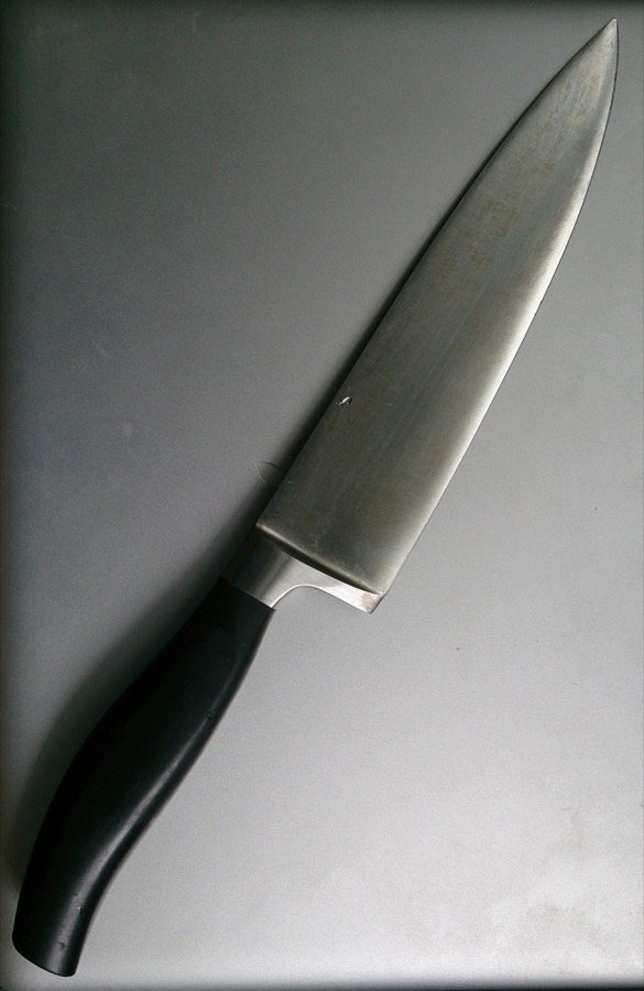 Wüsthof Classic 8-inch chef's knife on wooden cutting board